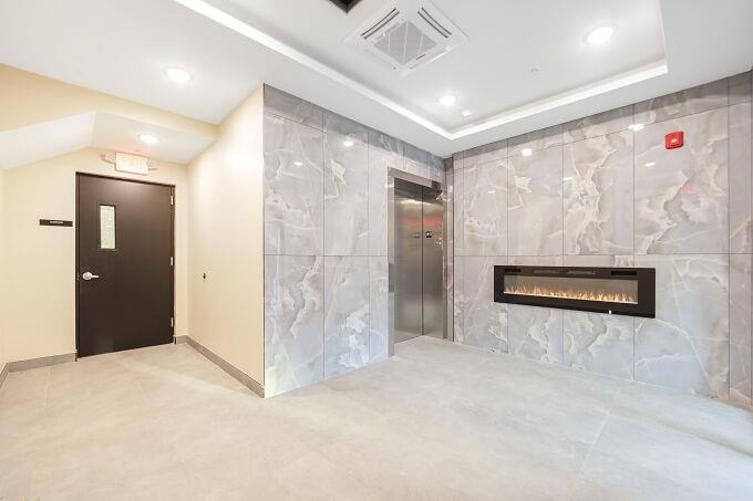 304 61st Street, Unit 1D West New York, NJ 07093 - Photo 8 of 44 a view of a hallway with stainless steel appliances