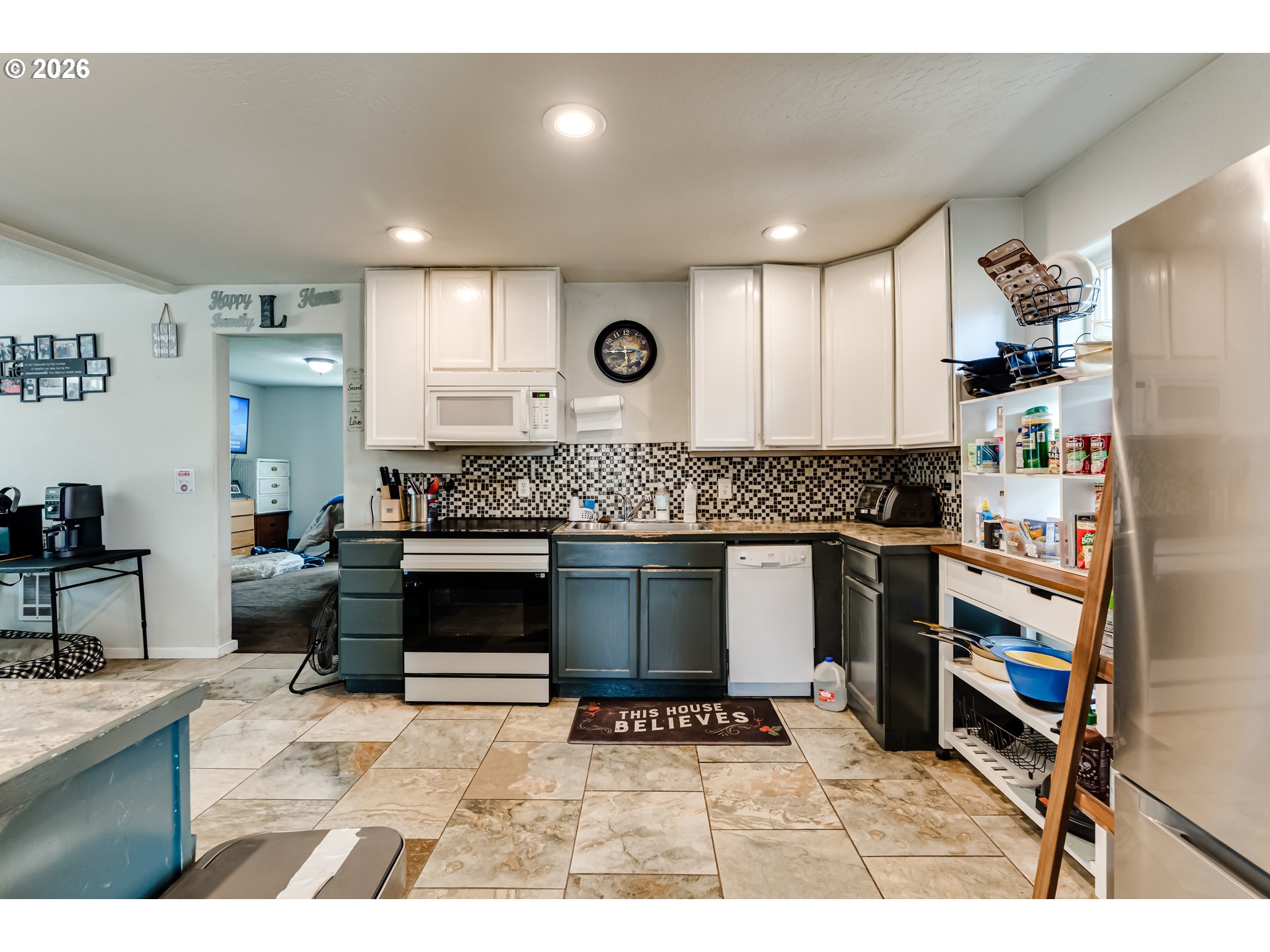 525 21st Street Springfield, OR 97477 - Photo 12 of 33 a kitchen with stainless steel appliances kitchen island granite countertop a stove a sink and a refrigerator