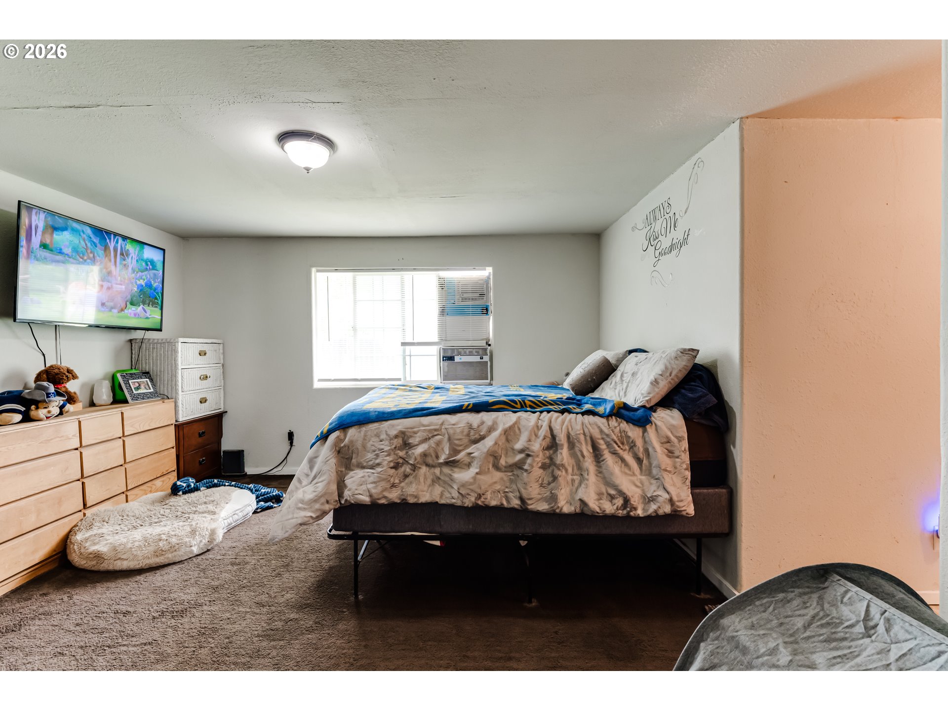 525 21st Street Springfield, OR 97477 - Photo 15 of 33 a bed sitting in a bedroom next to a window