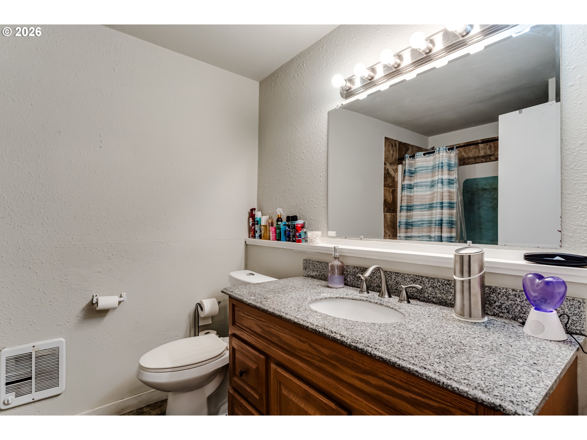 525 21st Street Springfield, OR 97477 - Photo 19 of 33 a bathroom with a granite countertop double vanity sink mirror and toilet