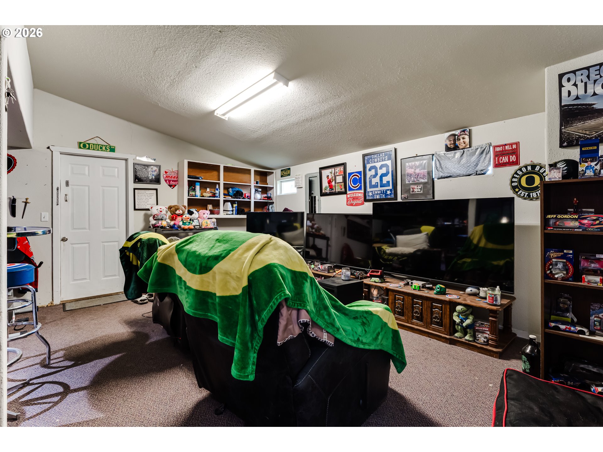 525 21st Street Springfield, OR 97477 - Photo 25 of 33 a living room with furniture a flat screen tv and a fireplace