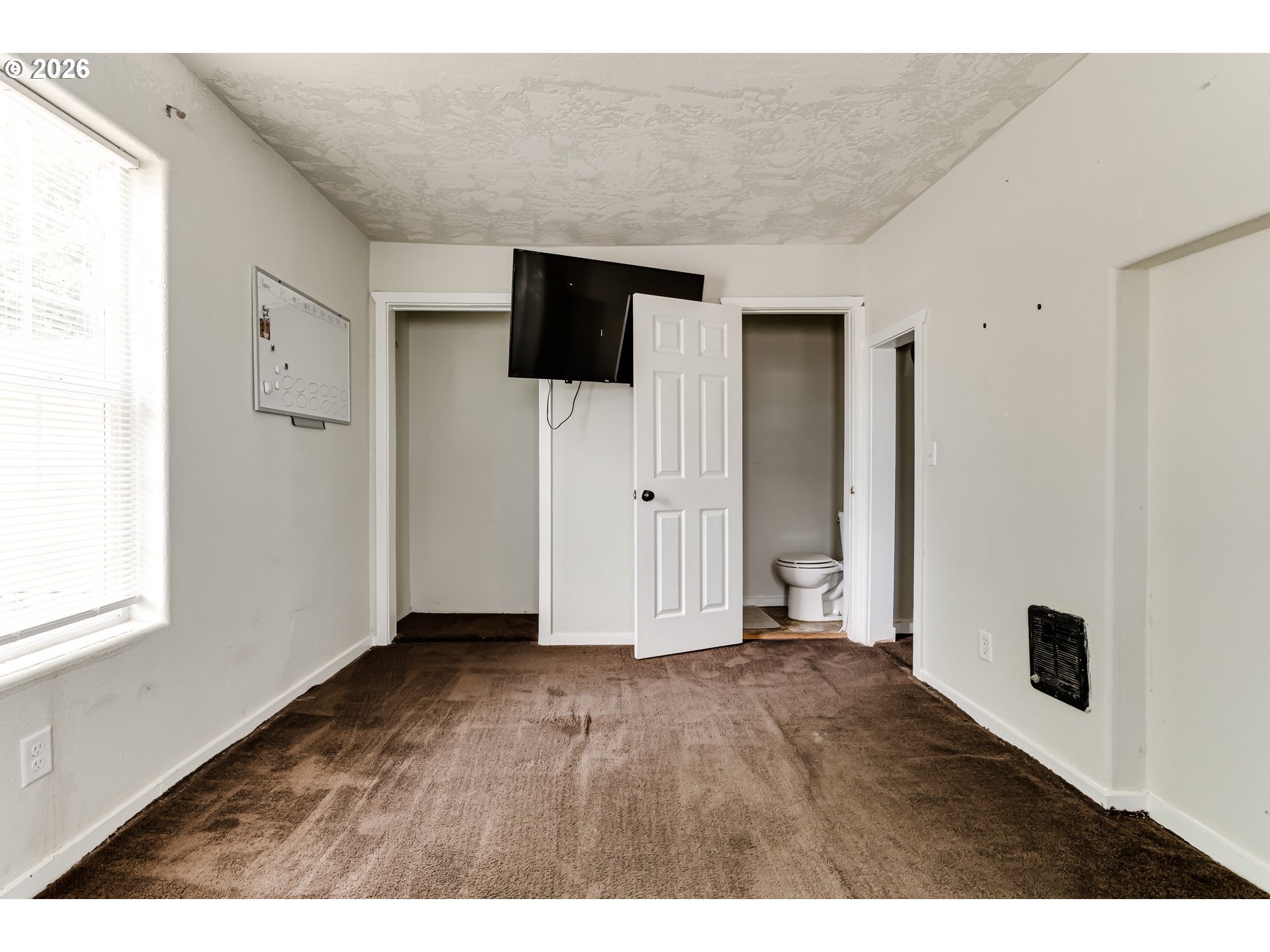 525 21st Street Springfield, OR 97477 - Photo 7 of 33 a view of an empty room with wooden floor and a window