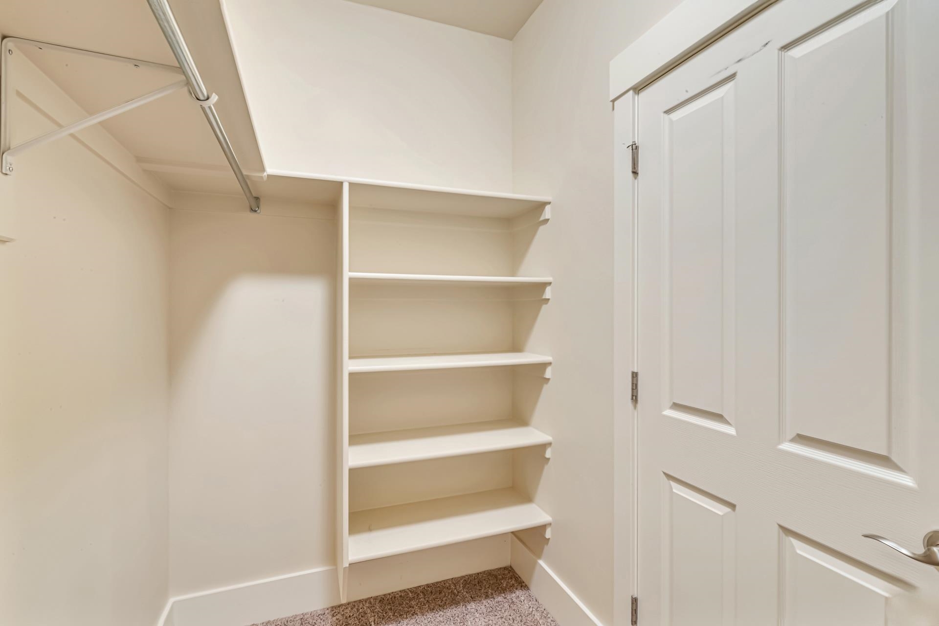 1215 Sunrose Lane, Unit 342 Fruita, CO 81521 - Photo 12 of 19 a view of walk in closet with empty racks