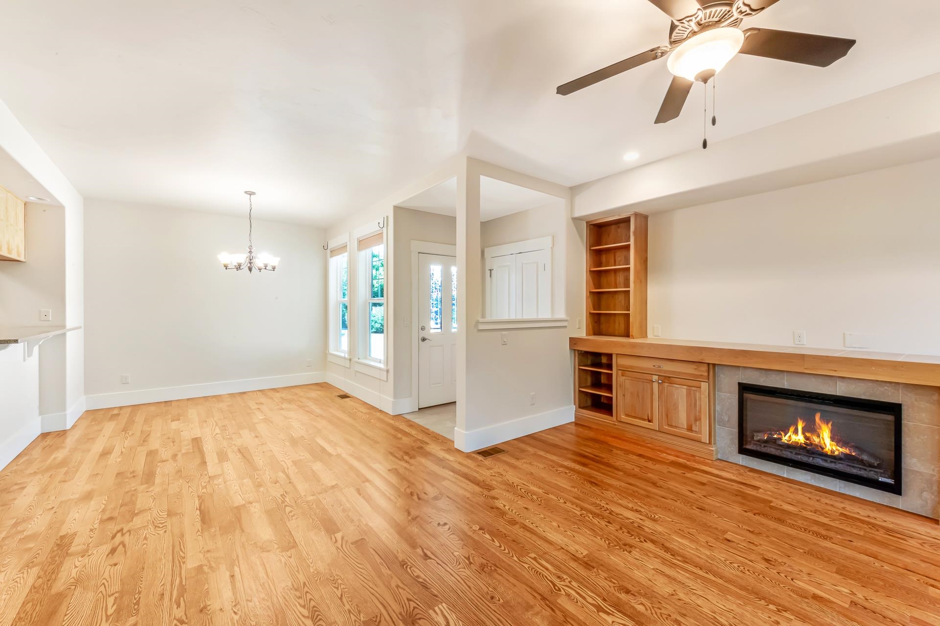 1215 Sunrose Lane, Unit 342 Fruita, CO 81521 - Photo 4 of 19 a view of an empty room with a fireplace and a ceiling fan