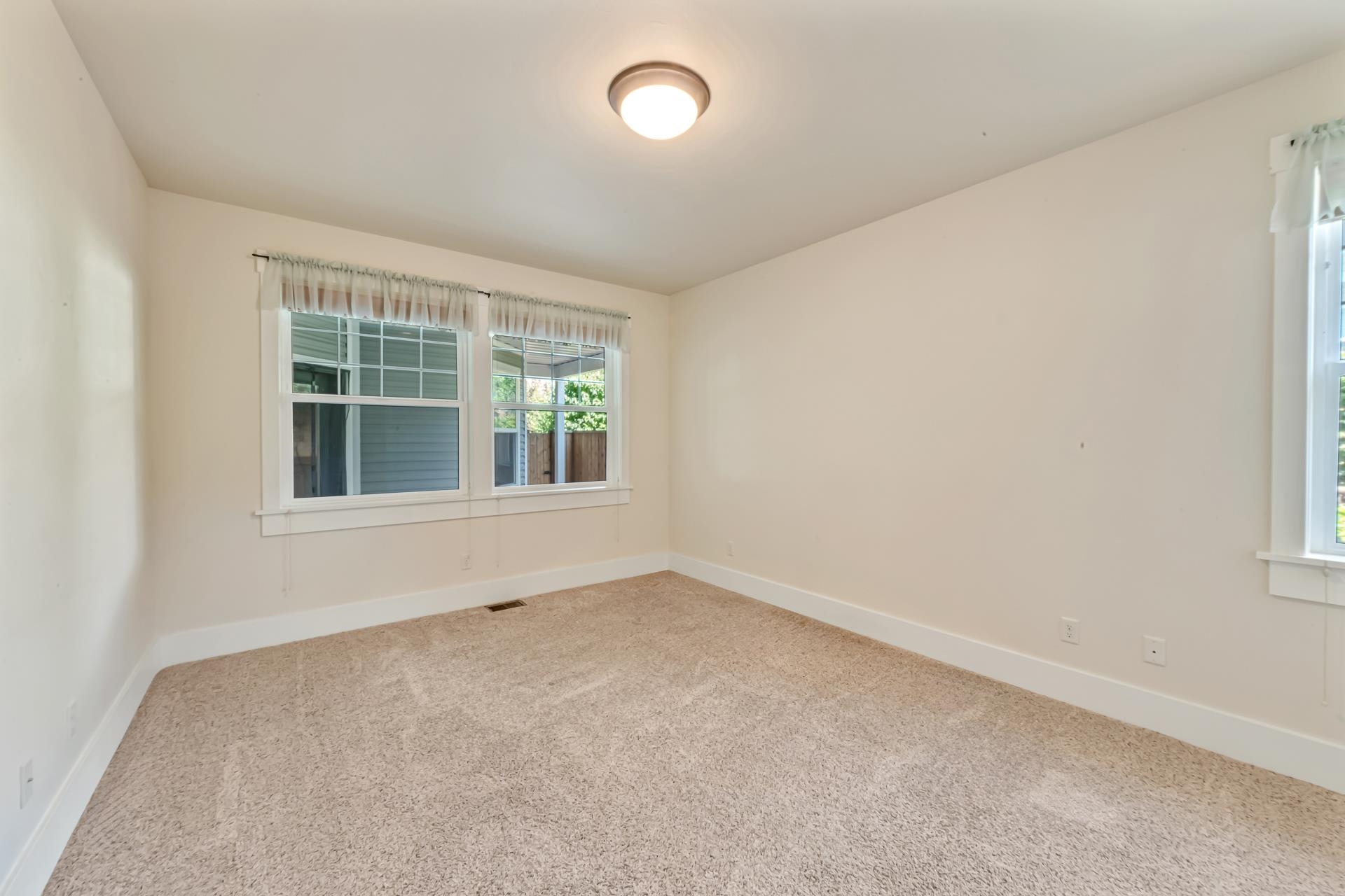 1215 Sunrose Lane, Unit 342 Fruita, CO 81521 - Photo 9 of 19 an empty room with windows