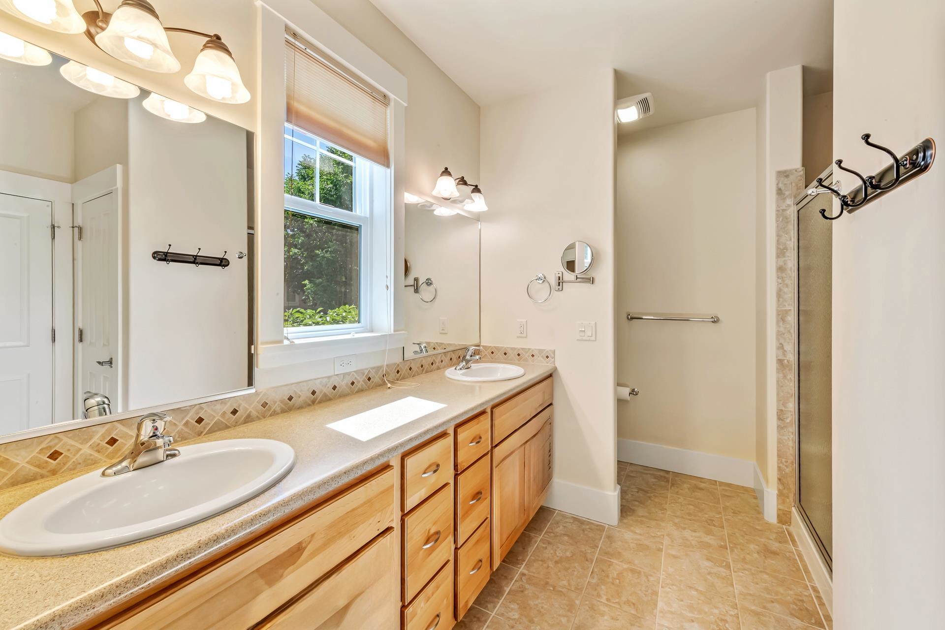 1215 Sunrose Lane, Unit 342 Fruita, CO 81521 - Photo 10 of 19 a spacious bathroom with a double vanity sink mirror and double