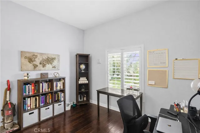 a bedroom with a bed and a night stand