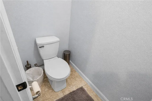 an aerial view of a house with a yard and lake view