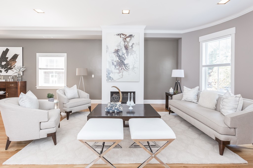 61 Dartmouth Street, Unit 1 Boston, MA 02116 - Photo 1 of 24 a living room with furniture or couch and a large window