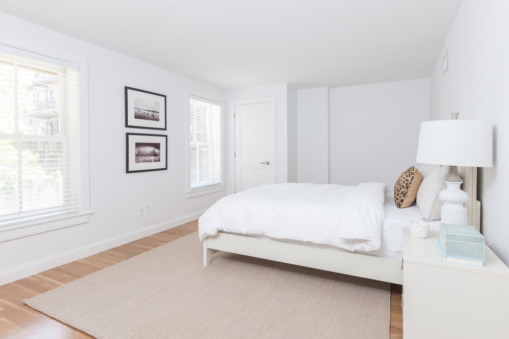 61 Dartmouth Street, Unit 1 Boston, MA 02116 - Photo 15 of 24 a bedroom with a bed and a window