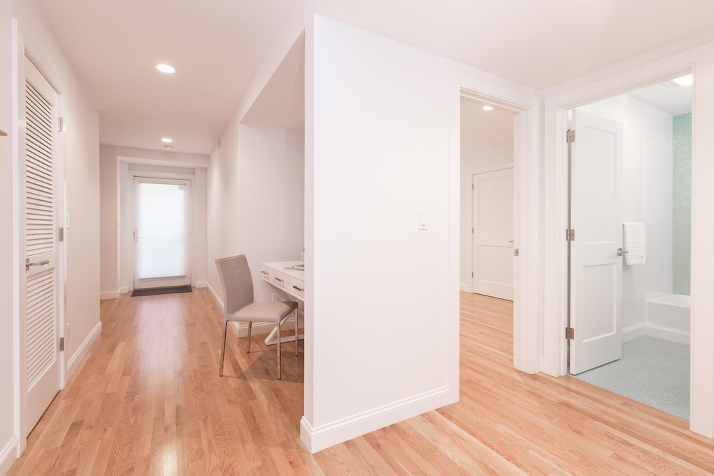 61 Dartmouth Street, Unit 1 Boston, MA 02116 - Photo 17 of 24 a view of a room with wooden floor and furniture