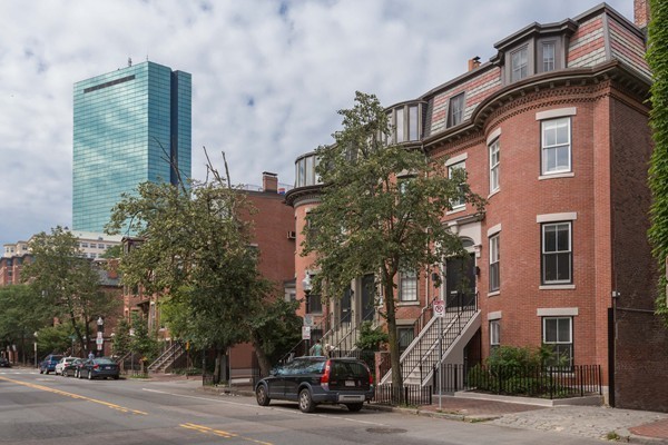 61 Dartmouth Street, Unit 1 Boston, MA 02116 - Photo 23 of 24 a car parked in front of a building