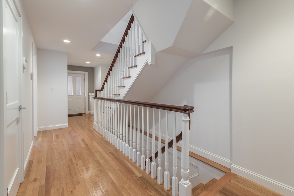 61 Dartmouth Street, Unit 1 Boston, MA 02116 - Photo 10 of 24 a view of a hallway with wooden floor and entryway