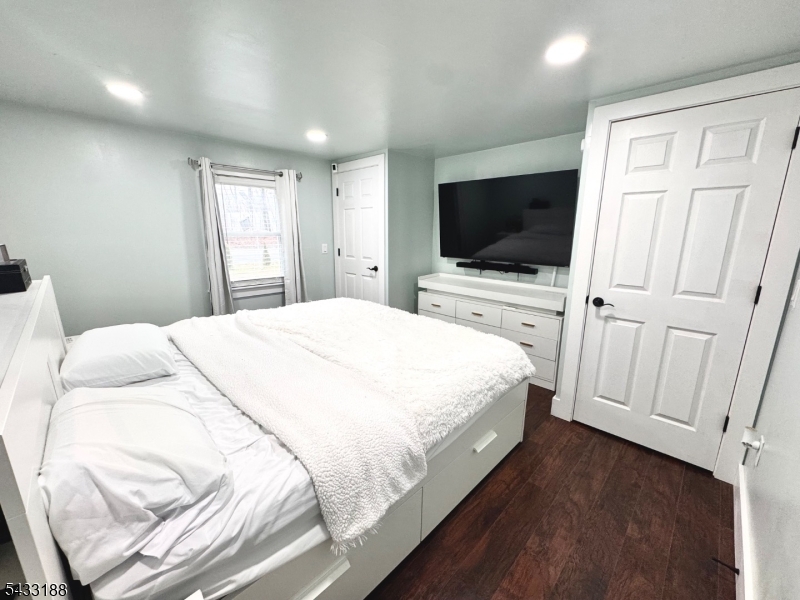 13 Highway 46 Columbia, NJ 07832 - Photo 10 of 22 a bedroom with a bed and a flat screen tv