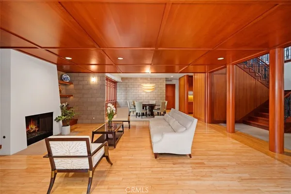 a dining room with furniture and wooden floor
