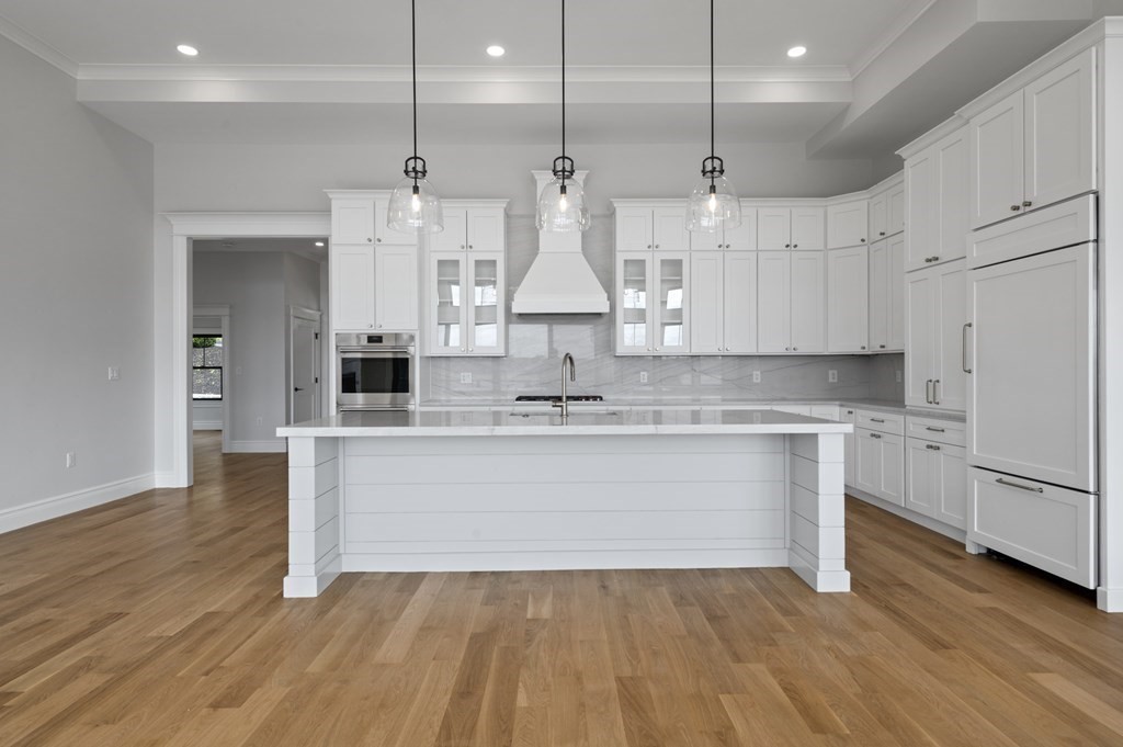 26 Pequot Road Marblehead, MA 01945 - Photo 11 of 40 a large kitchen with kitchen island white cabinets and stainless steel appliances