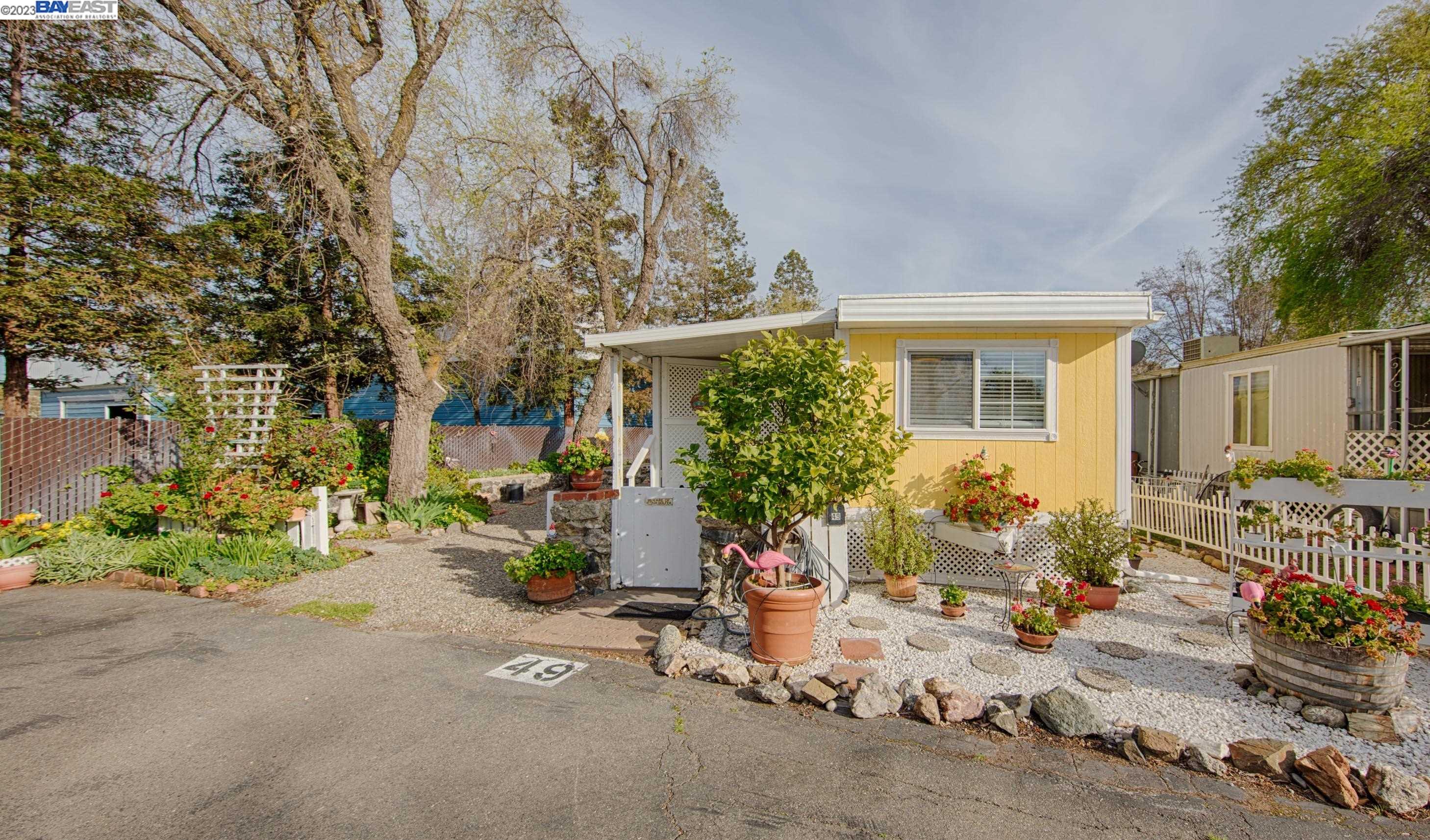 6539 Southfront Road, Unit 49 Livermore, CA 94551 - Photo 1 of 1 front view of a house with a street