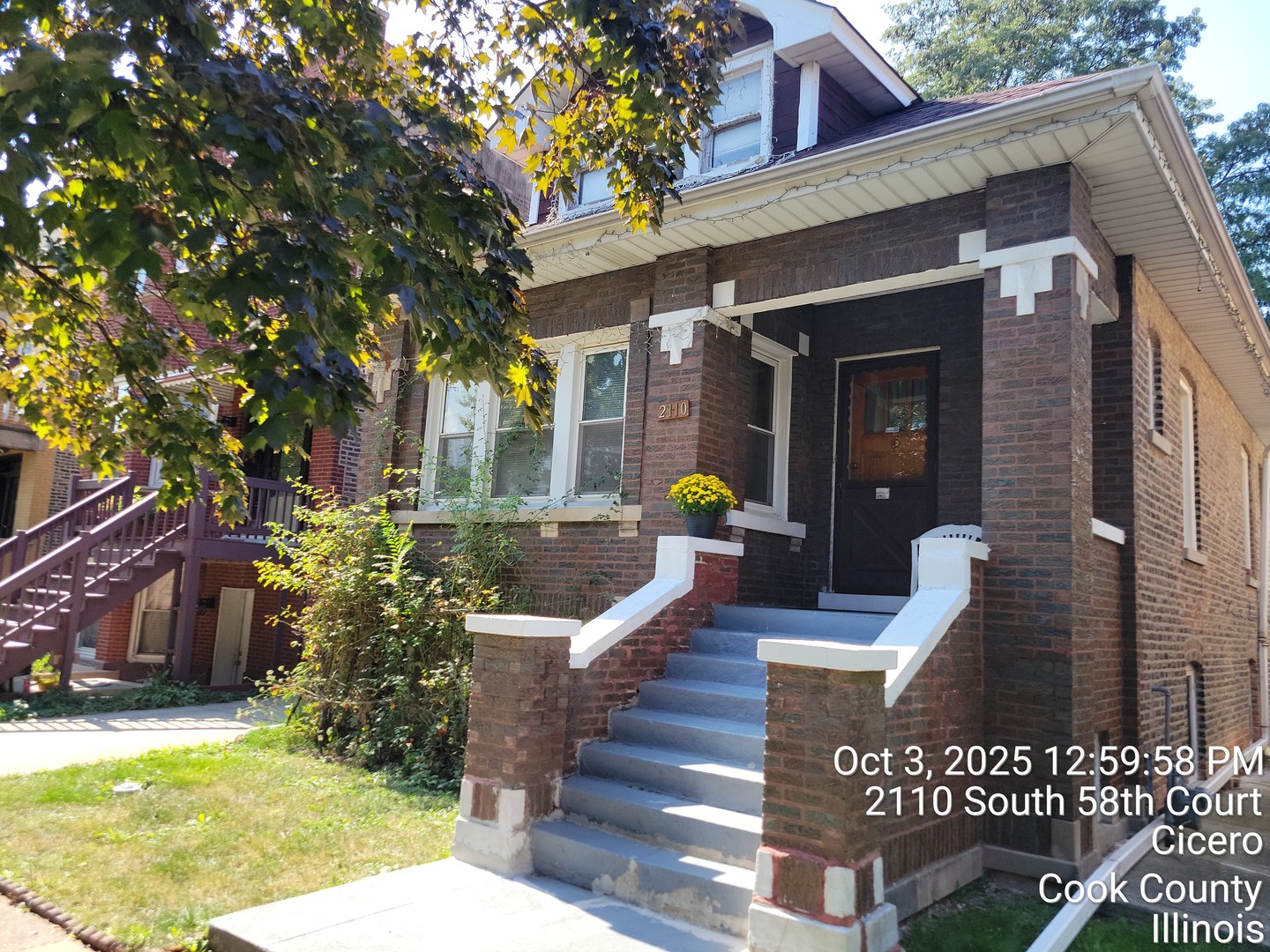 a view of a patio with couches table and chairs and potted plants