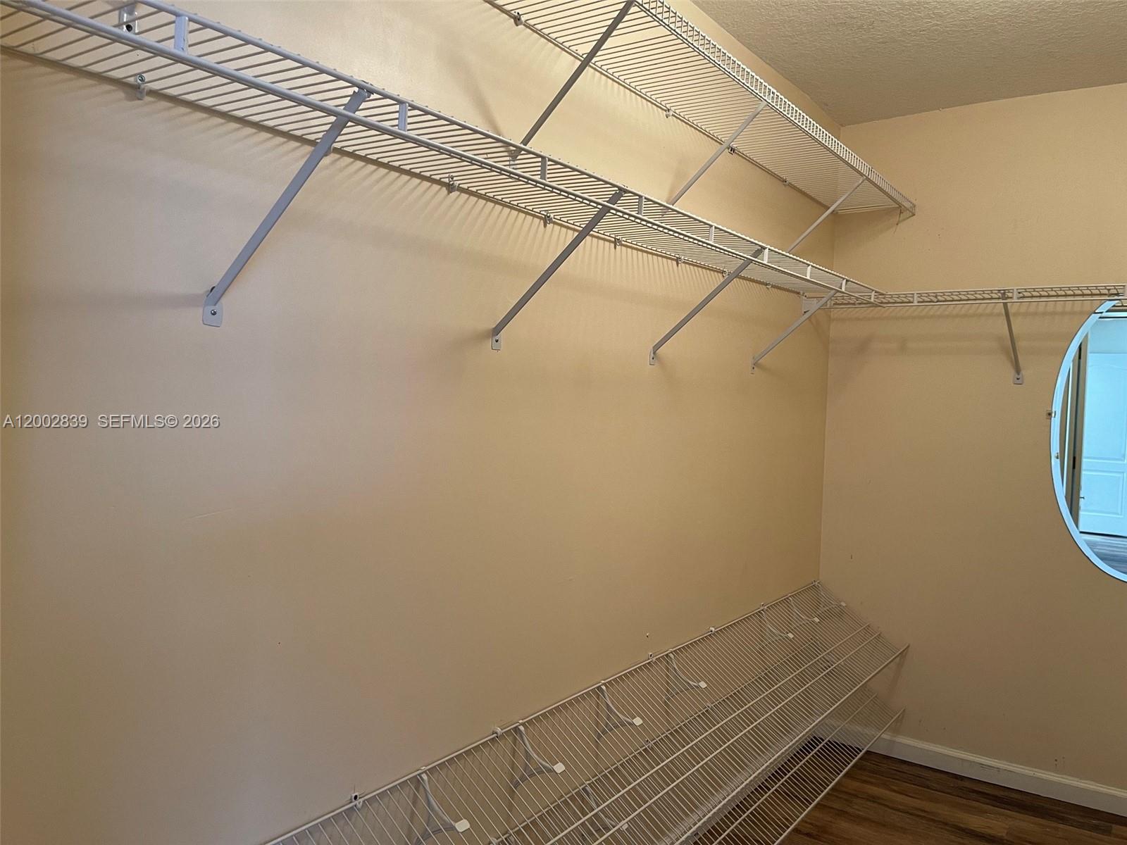 15873 Southwest 43rd Street Miami, FL 33185 - Photo 8 of 23 a view of a room with racks on the wall