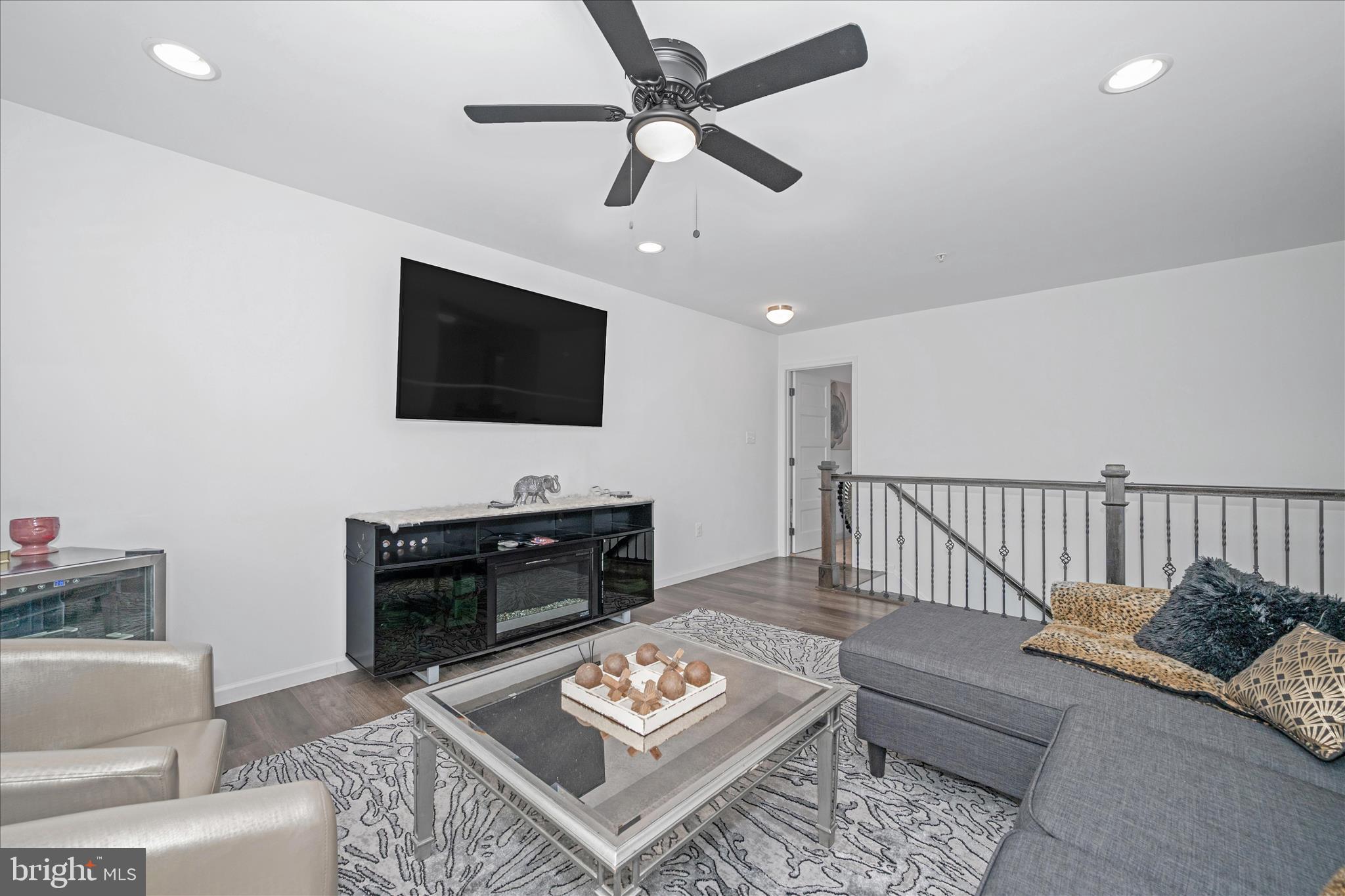 1388 Rocky Springs Road Frederick, MD 21702 - Photo 39 of 97 a living room with furniture and a flat screen tv