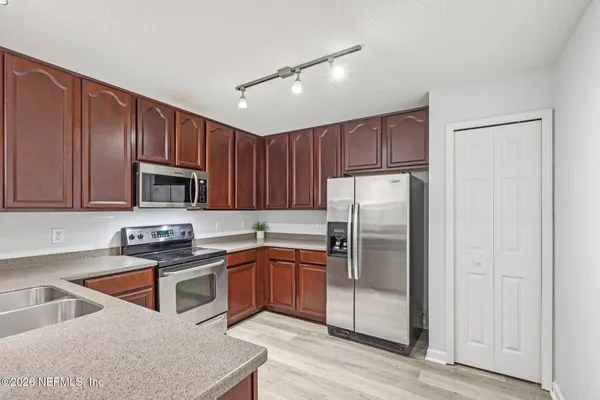 a view of a swimming pool with a lounge chair