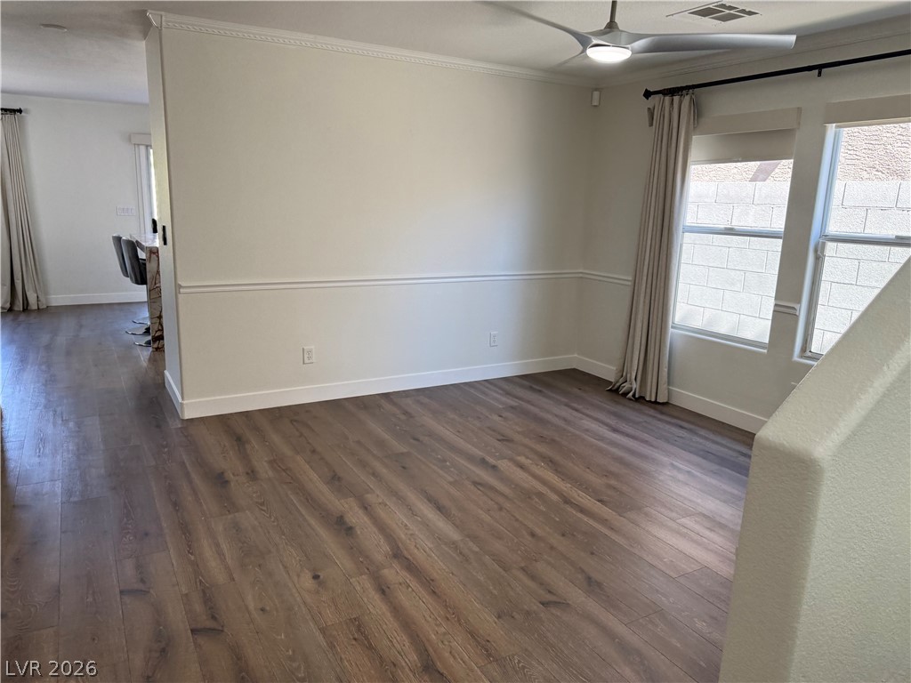 1141 Cathedral Ridge Street Henderson, NV 89052 - Photo 7 of 77 This versatile space offers flexible living with abundant natural light and rich wood flooring.