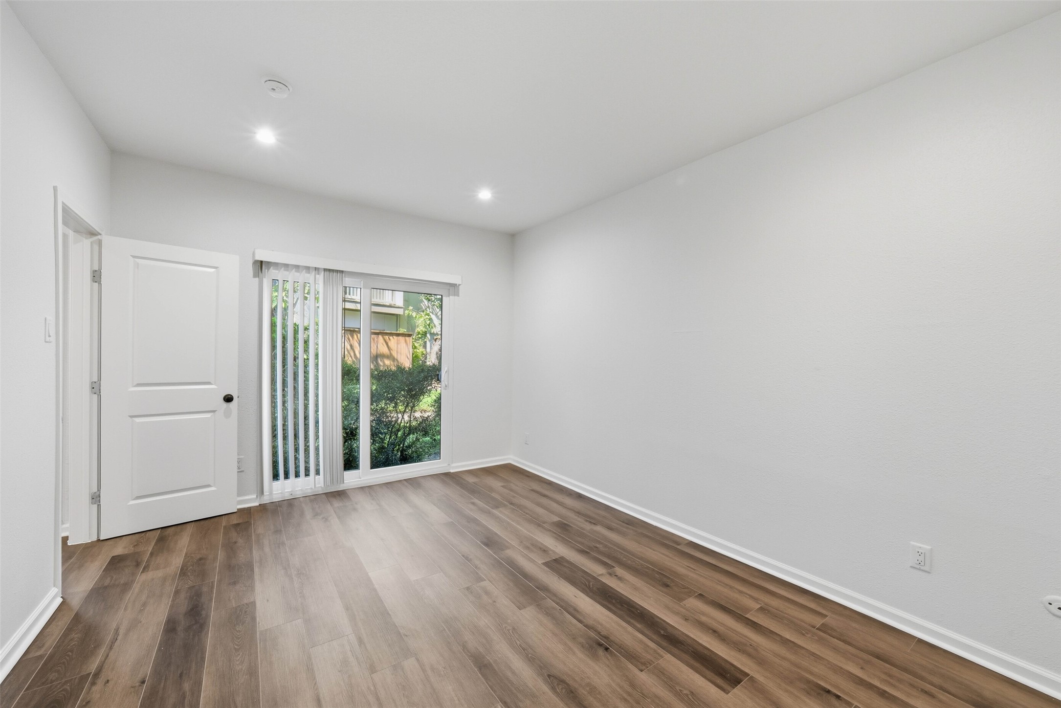2100 Tanglewilde Street, Unit 625 Houston, TX 77063 - Photo 14 of 23 a view of an empty room with wooden floor