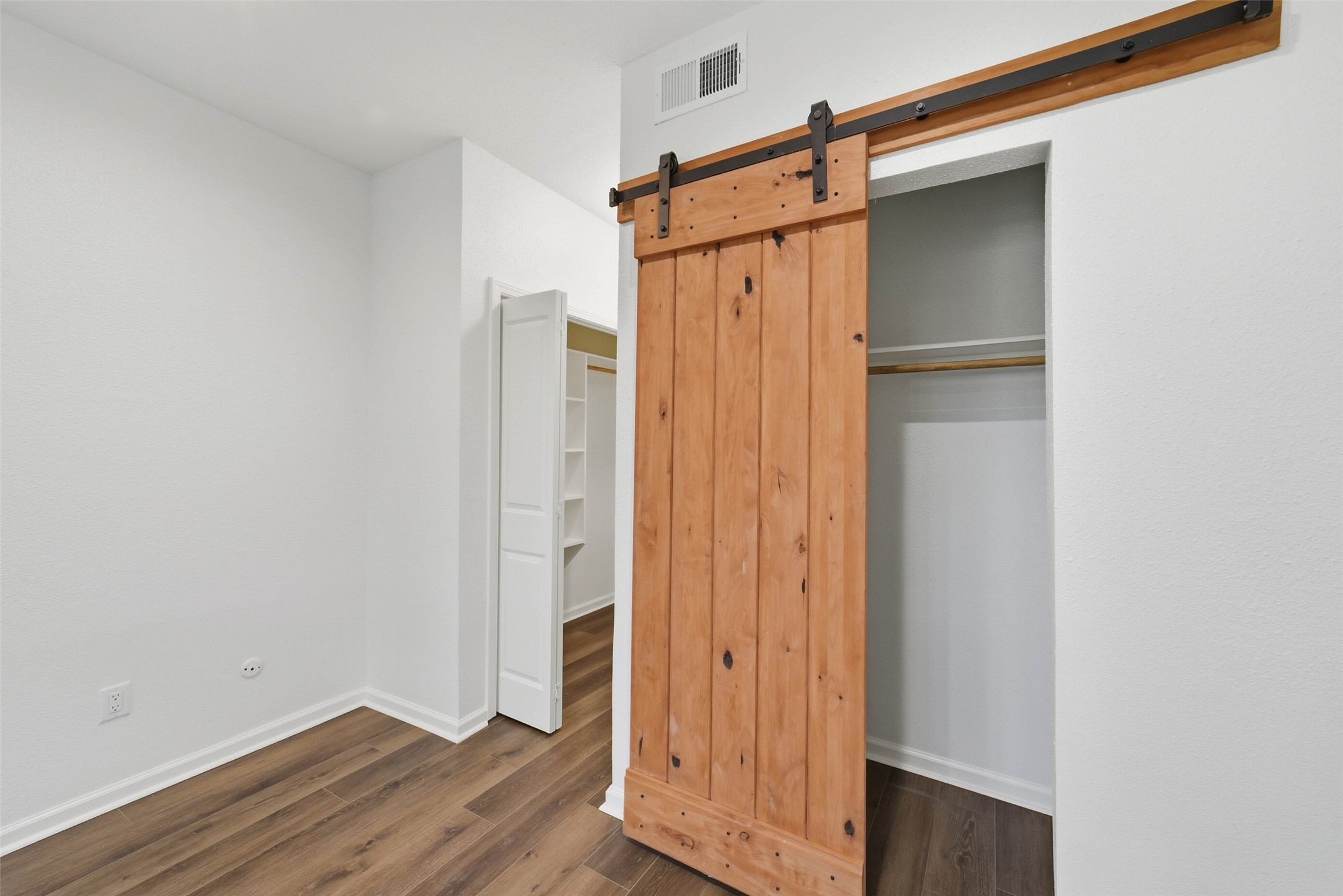 2100 Tanglewilde Street, Unit 625 Houston, TX 77063 - Photo 15 of 23 a view of front door with wooden floor