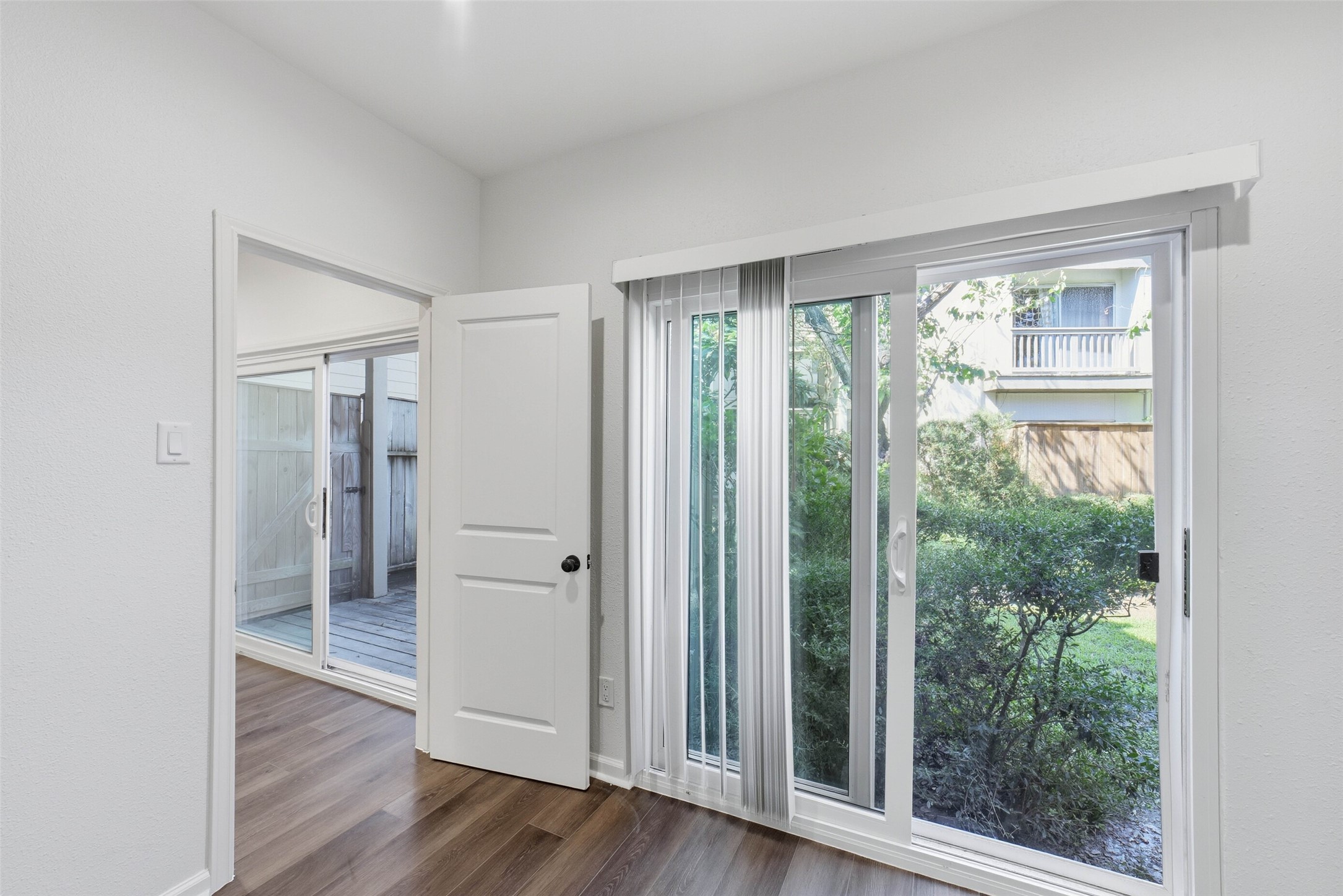 2100 Tanglewilde Street, Unit 625 Houston, TX 77063 - Photo 19 of 23 an empty room with wooden floor and windows