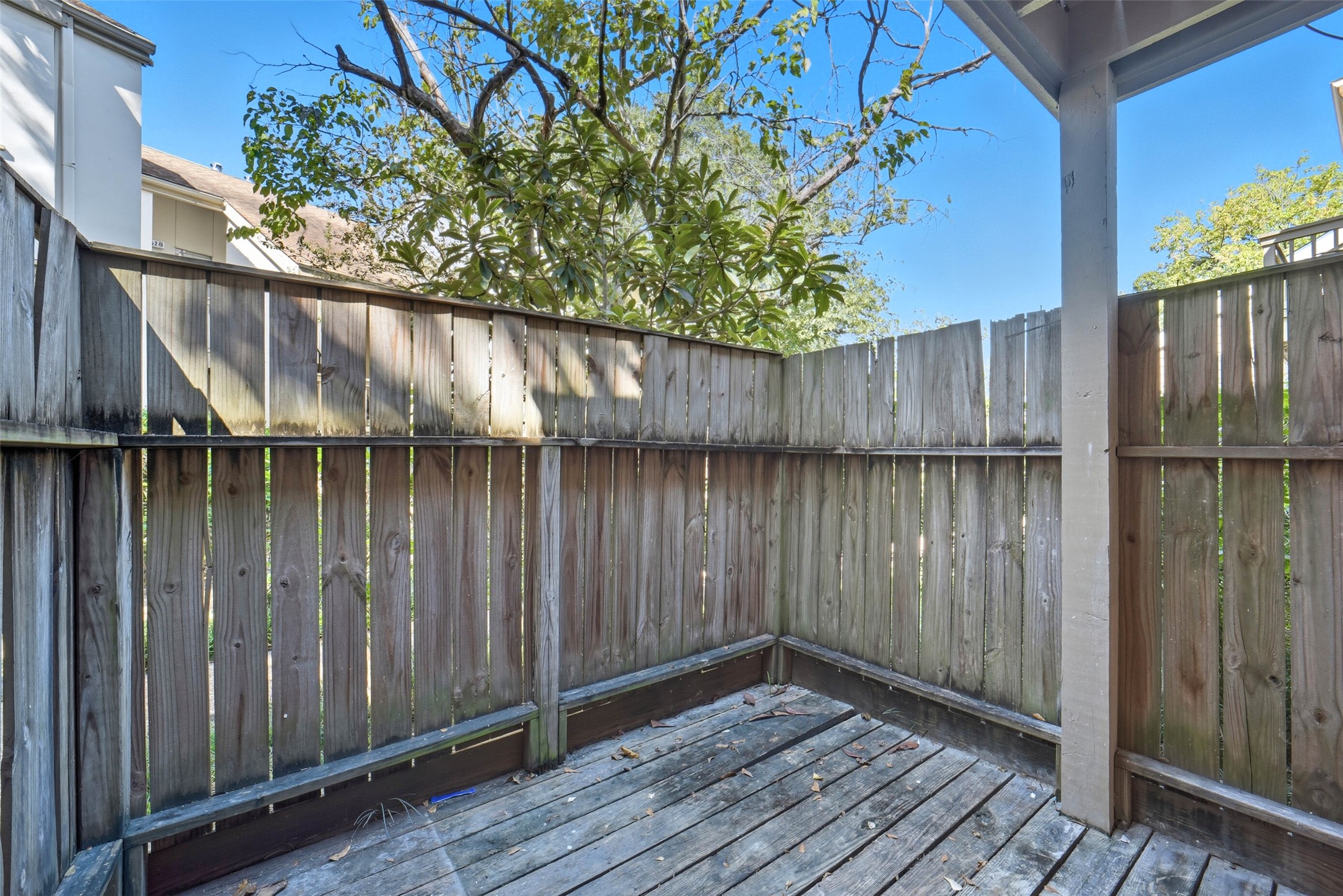 2100 Tanglewilde Street, Unit 625 Houston, TX 77063 - Photo 20 of 23 a view of a house with a wooden fence