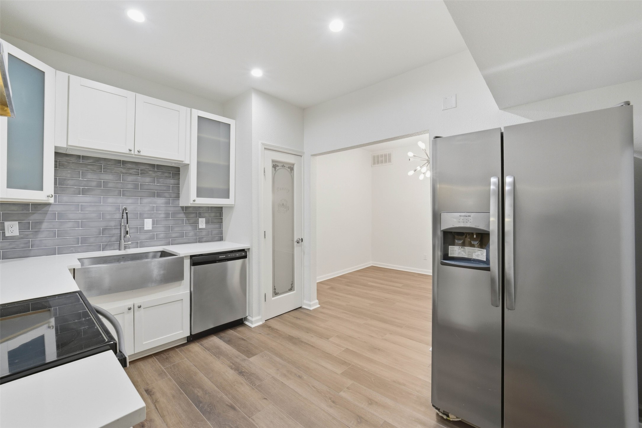 2100 Tanglewilde Street, Unit 625 Houston, TX 77063 - Photo 6 of 23 a kitchen with a refrigerator and a sink
