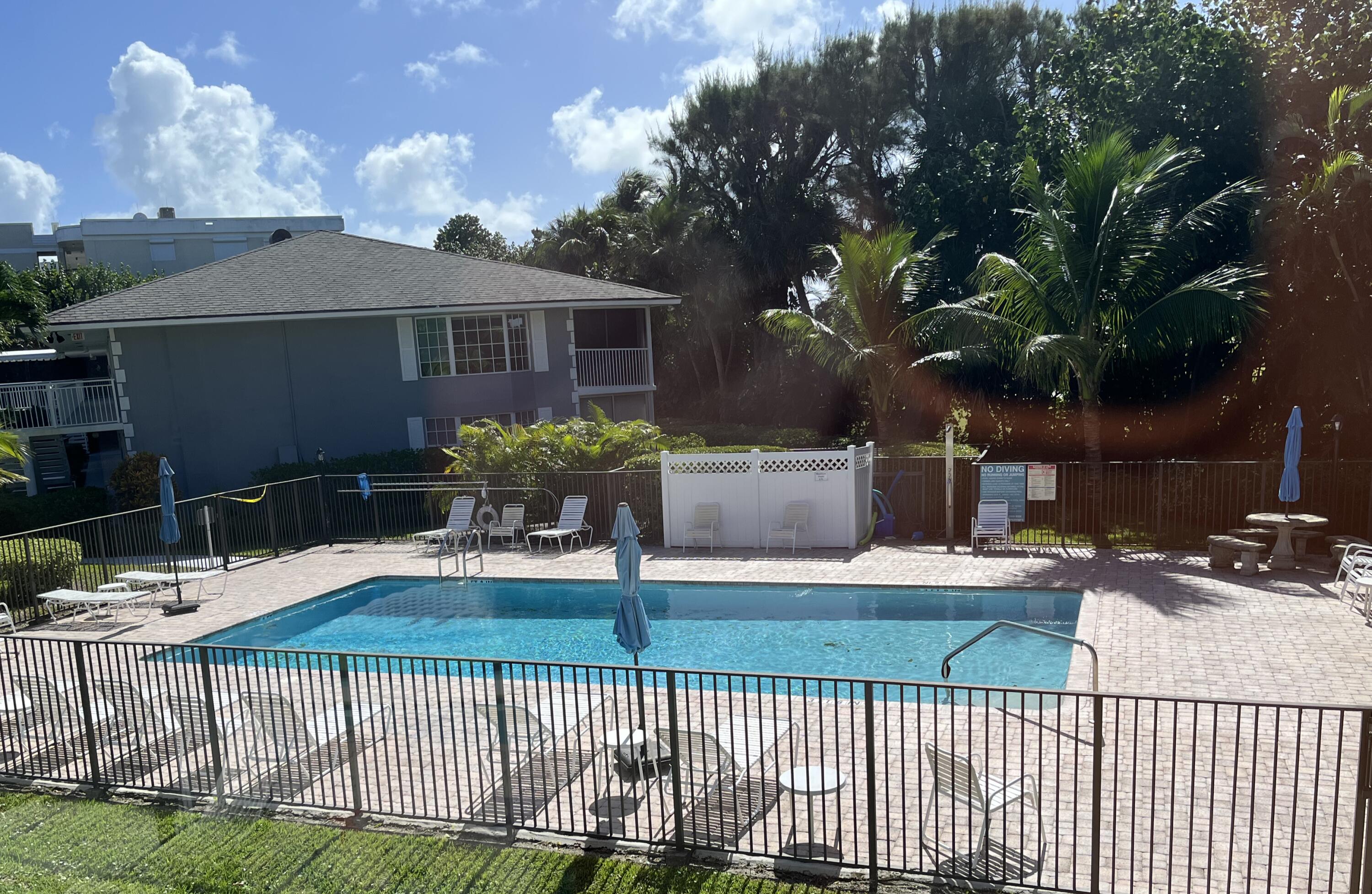 50 Celestial Way, Unit 207 Juno Beach, FL 33408 - Photo 12 of 30 a view of a house with backyard and sitting area