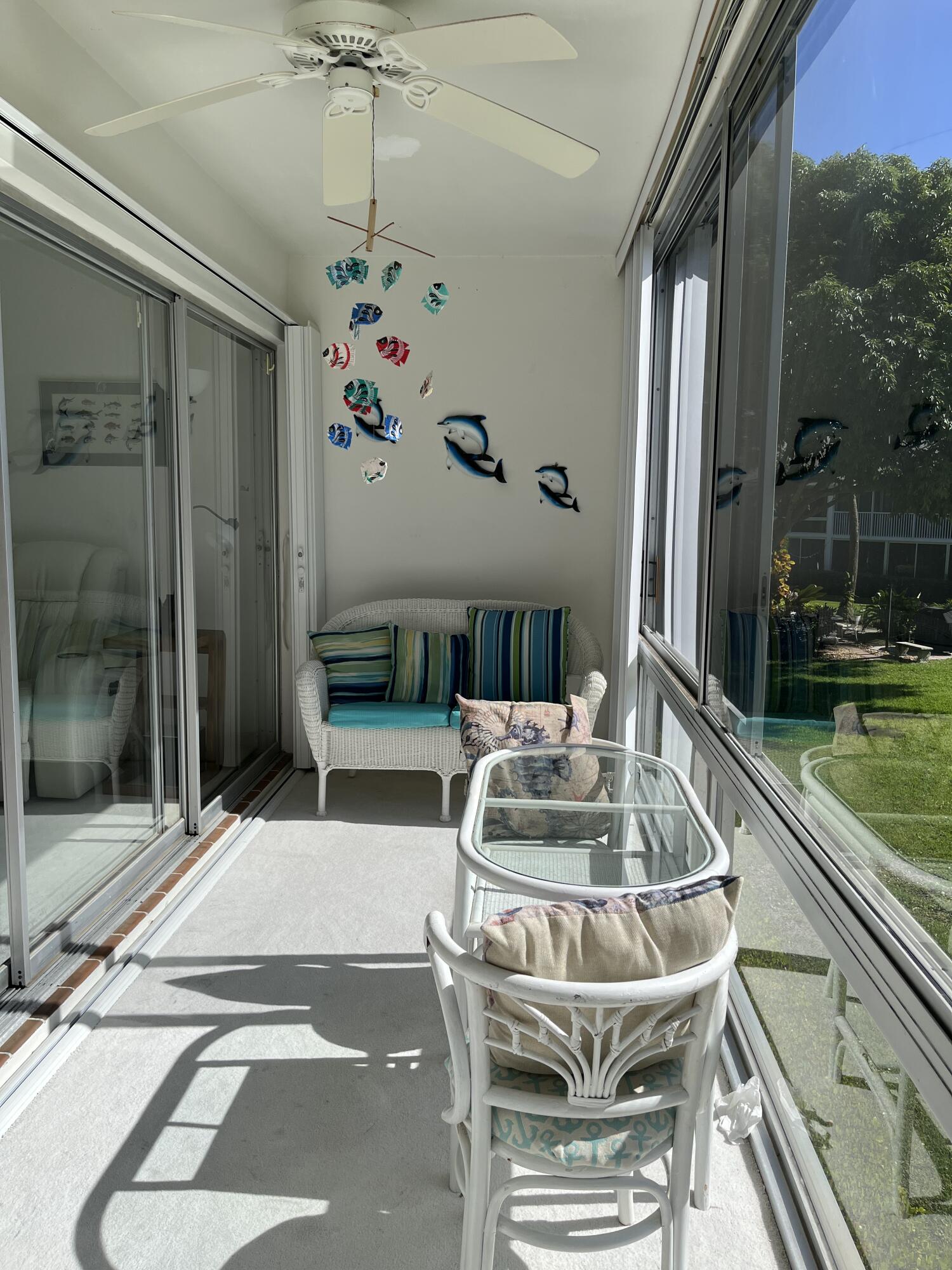 50 Celestial Way, Unit 207 Juno Beach, FL 33408 - Photo 14 of 30 a living room with patio