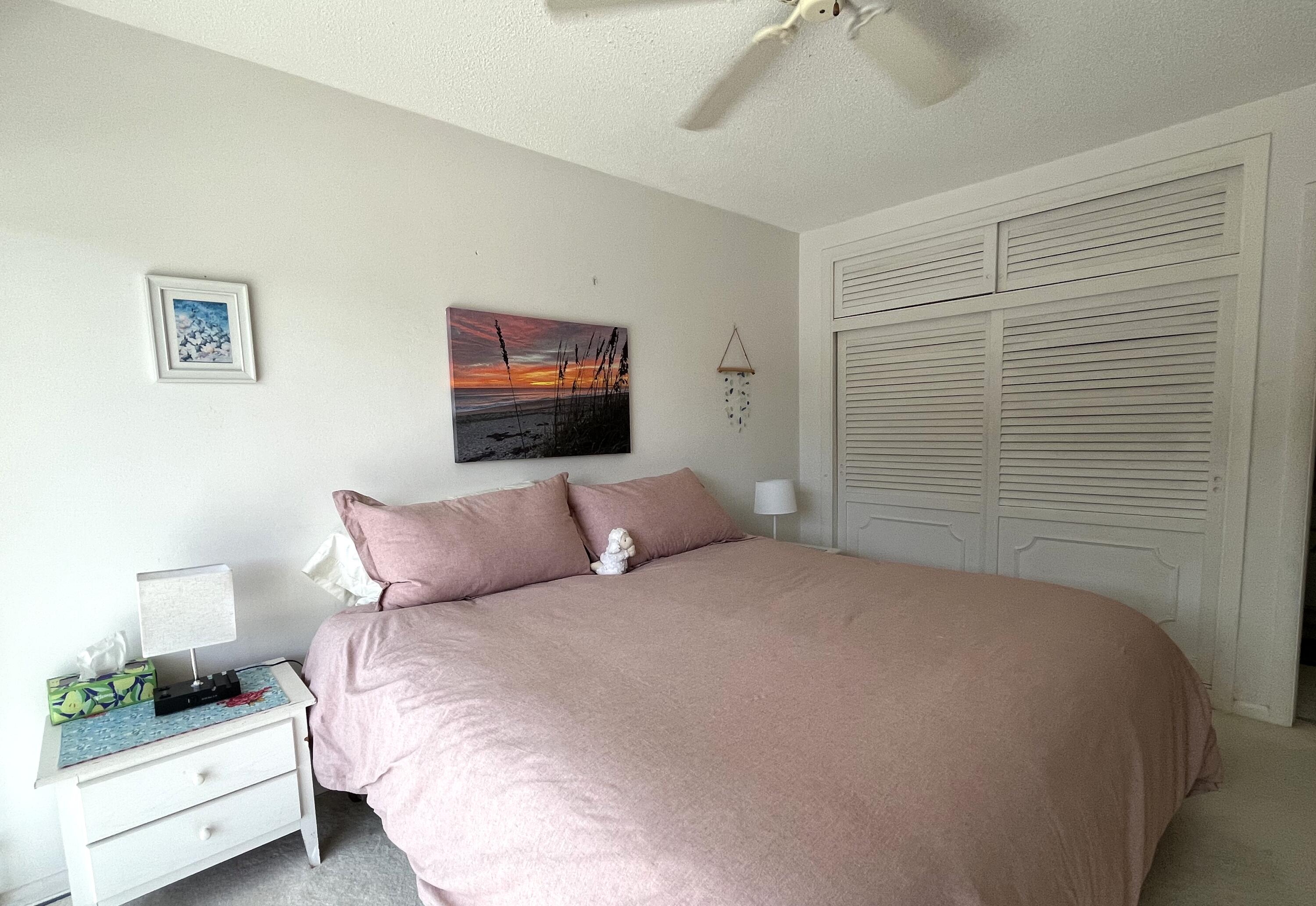 50 Celestial Way, Unit 207 Juno Beach, FL 33408 - Photo 20 of 30 a bedroom with a bed and a window