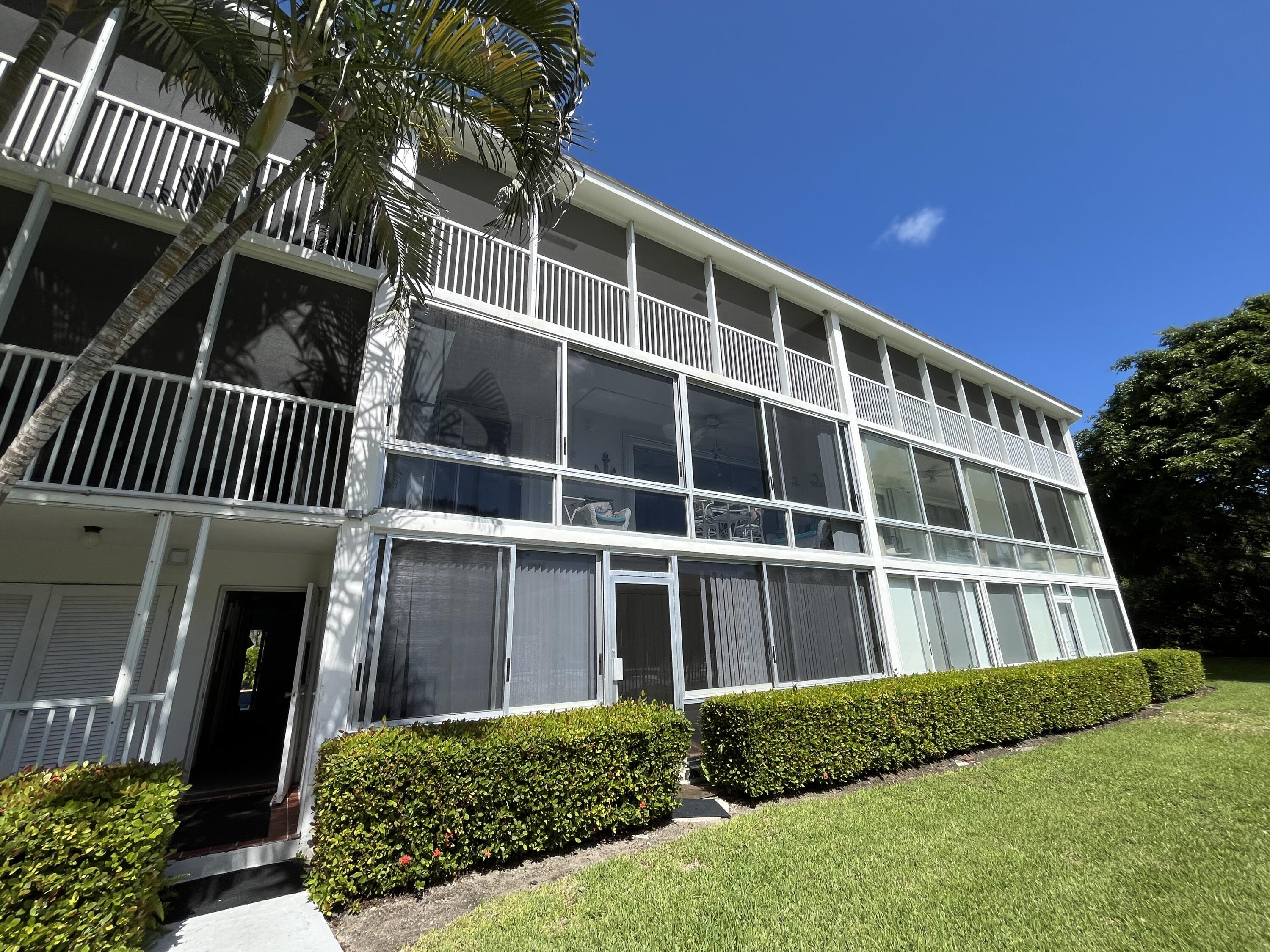 50 Celestial Way, Unit 207 Juno Beach, FL 33408 - Photo 25 of 30 a view of a house with backyard and porch