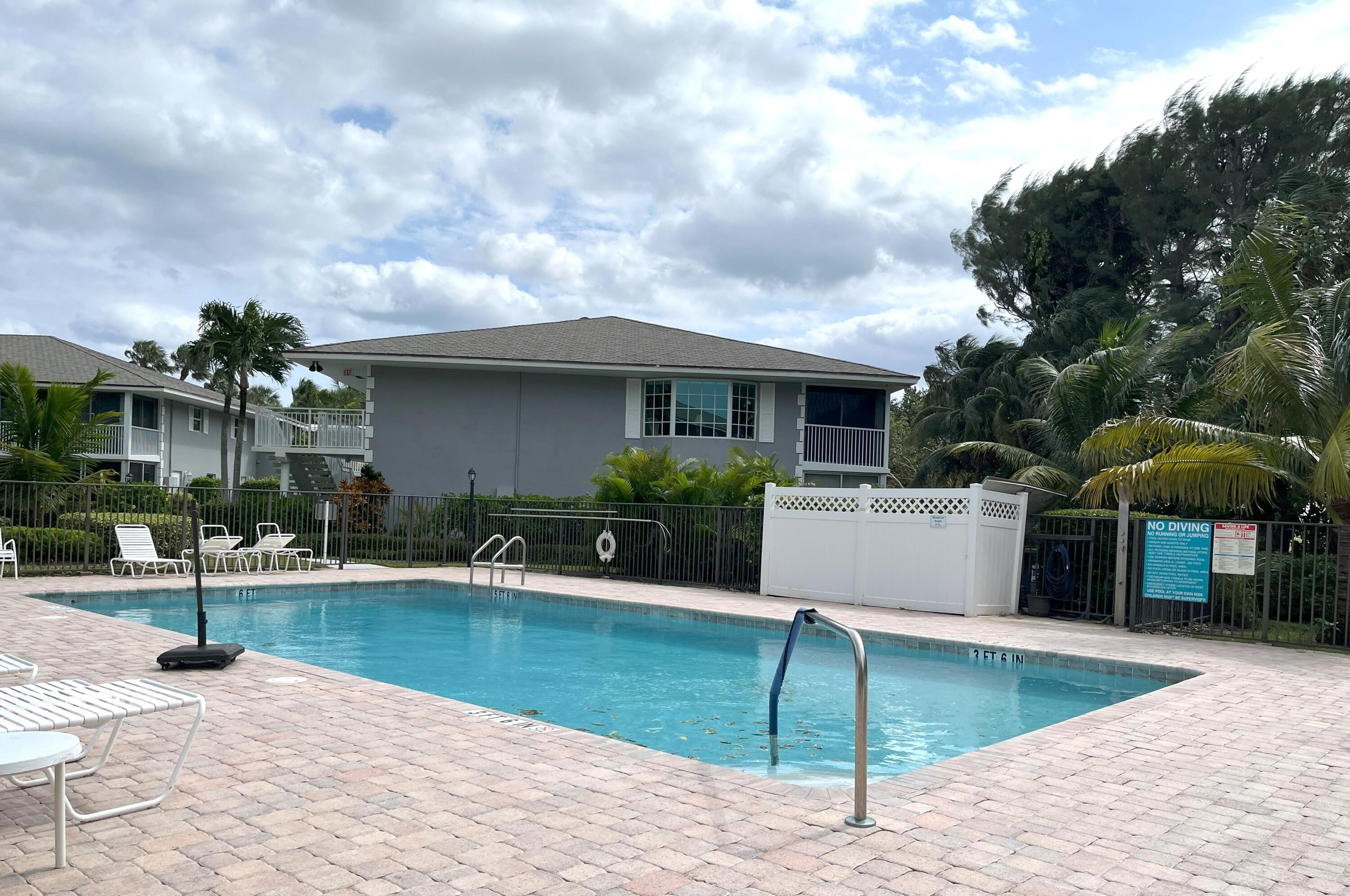50 Celestial Way, Unit 207 Juno Beach, FL 33408 - Photo 26 of 30 a view of a house with backyard and sitting area