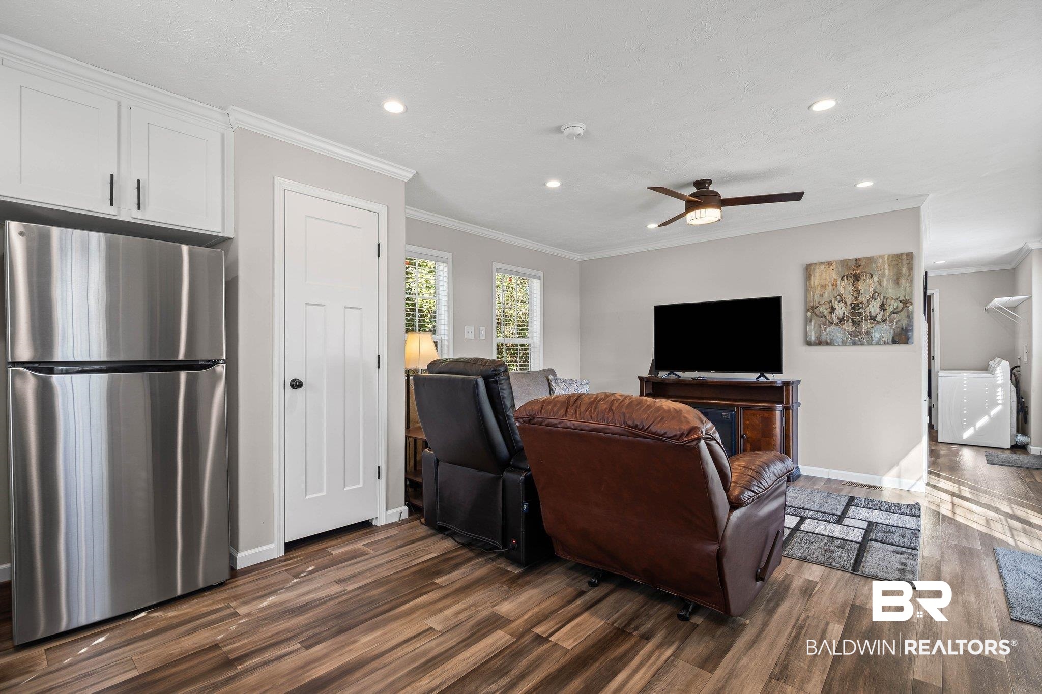 1325 Ridgewood Drive Lillian, AL 36549 - Photo 5 of 32 Living room with crown molding, dark wood-type flooring, recessed lighting, and a ceiling fan