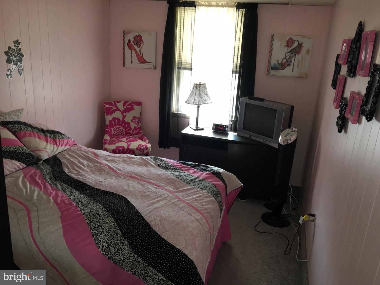 17 Southridge Road Darby, PA 19023 - Photo 14 of 21 a bedroom with a bed and a window