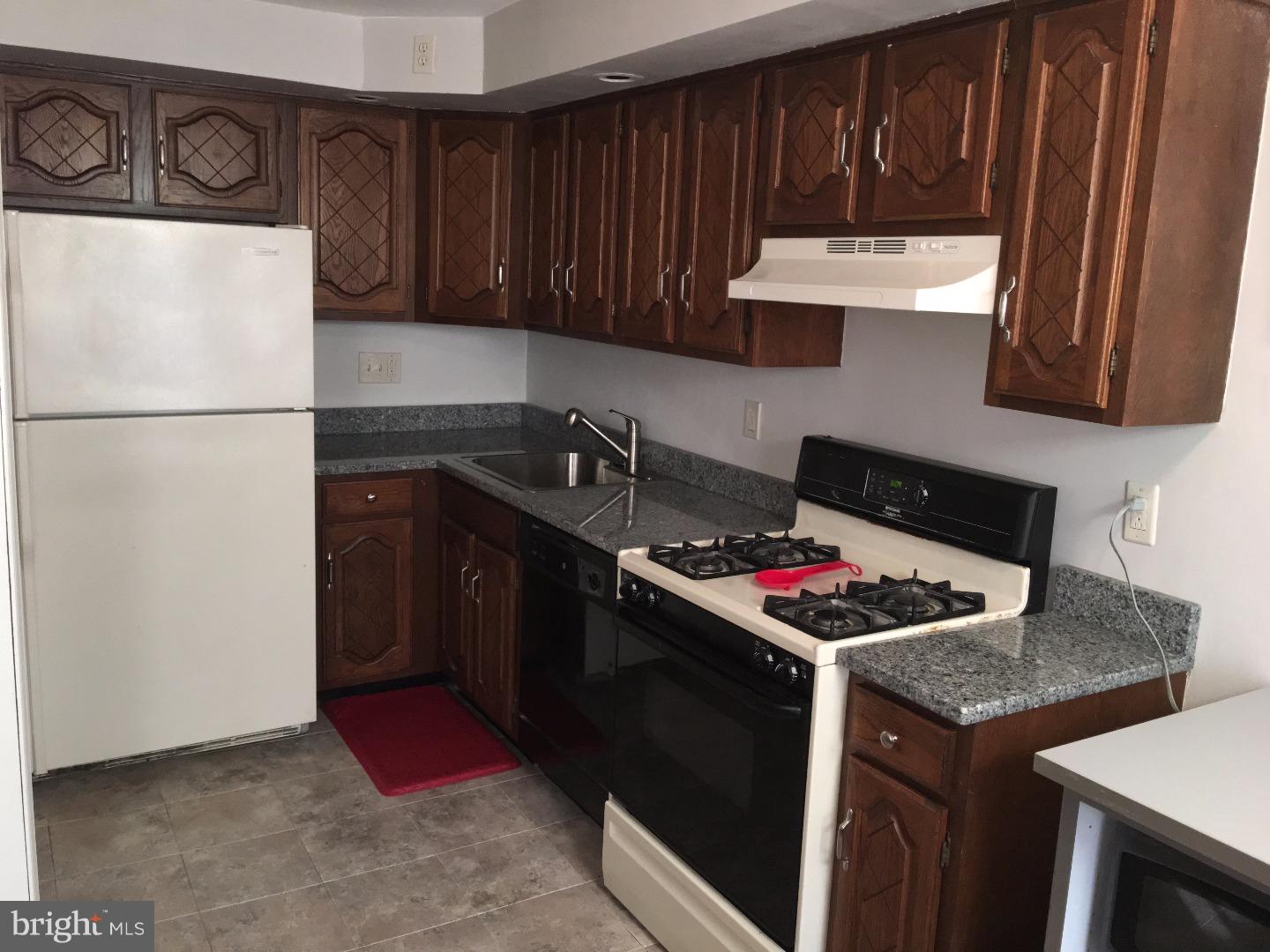 17 Southridge Road Darby, PA 19023 - Photo 8 of 21 a kitchen with a stove and a refrigerator