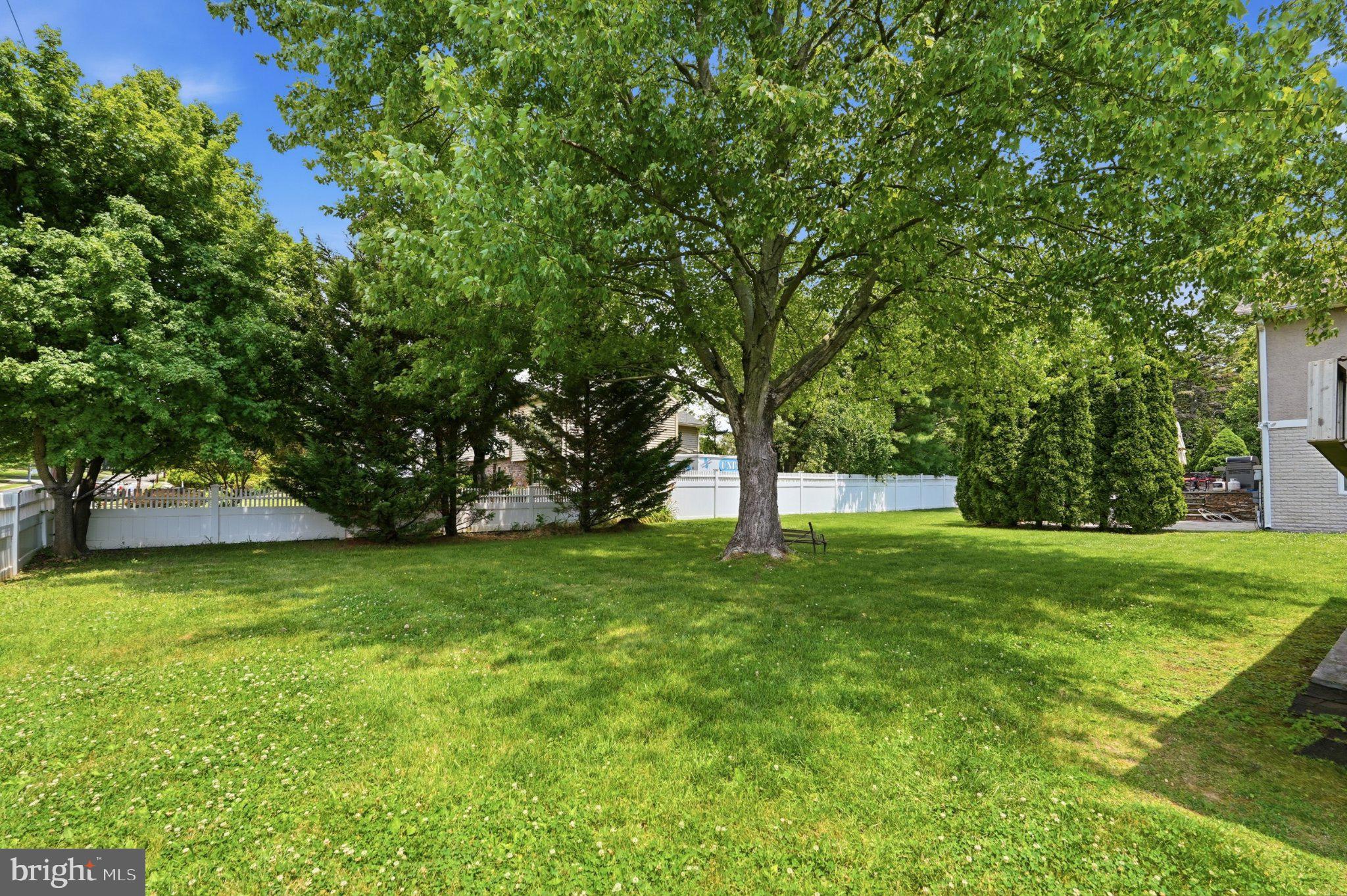 1002 Tannerie Run Road Ambler, PA 19002 - Photo 63 of 67 Lush green yard under a clear sky.