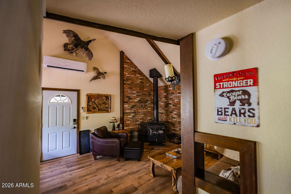 838 Palomino Way Payson, AZ 85541 - Photo 33 of 87 a bedroom with furniture and a wooden floor