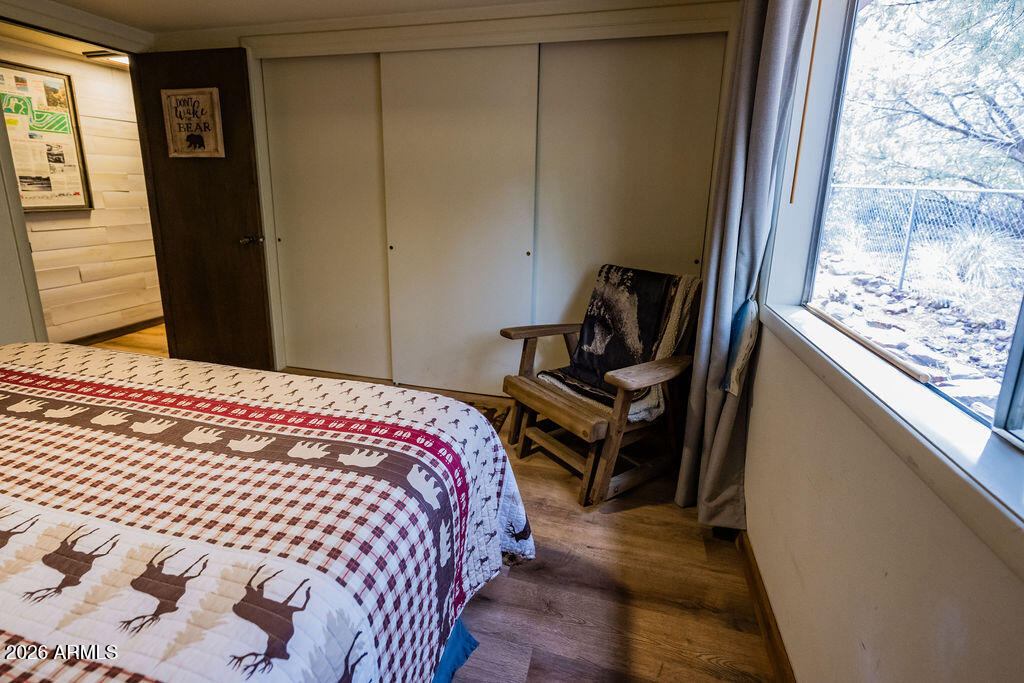 838 Palomino Way Payson, AZ 85541 - Photo 50 of 87 a bedroom with a bed and wooden floor