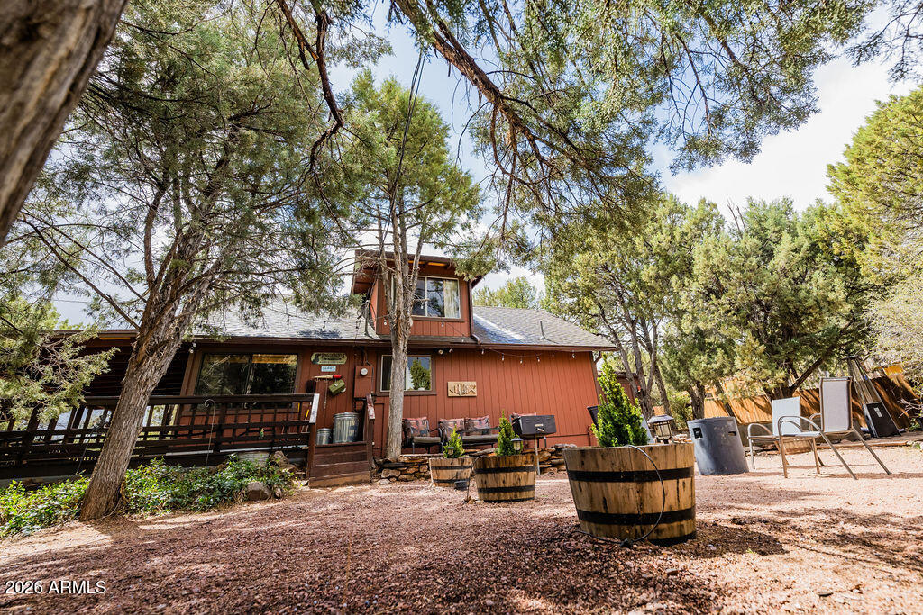 838 Palomino Way Payson, AZ 85541 - Photo 6 of 87 a front view of a house with garden and trees