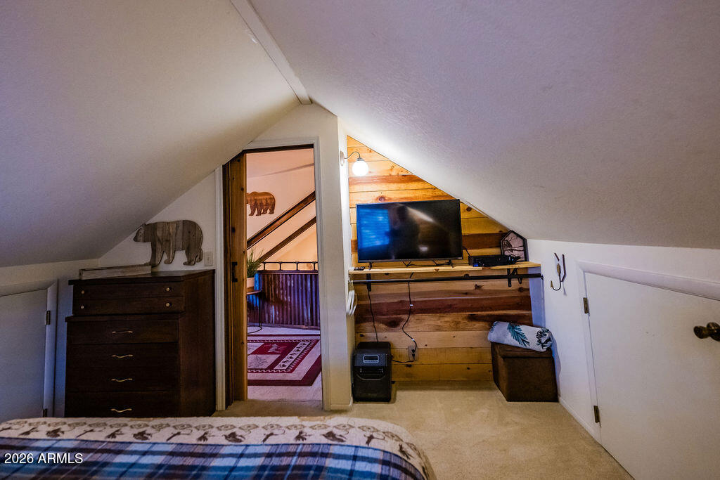 838 Palomino Way Payson, AZ 85541 - Photo 61 of 87 a view of walk in closet with clothes and shoes