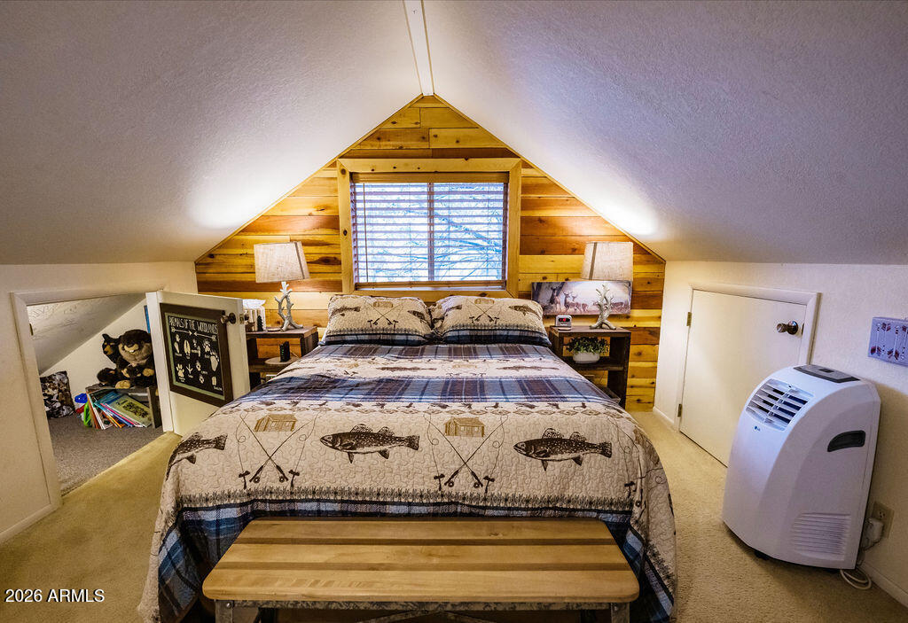 838 Palomino Way Payson, AZ 85541 - Photo 62 of 87 a bed sitting in a bedroom next to a window