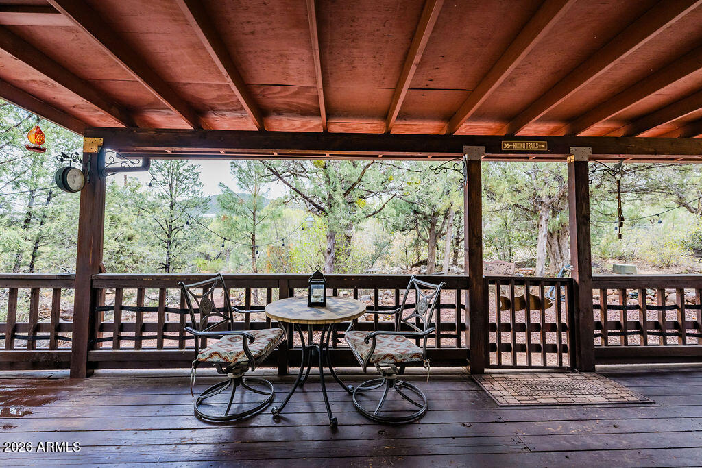 838 Palomino Way Payson, AZ 85541 - Photo 9 of 87 a view of a porch with furniture and wooden floor