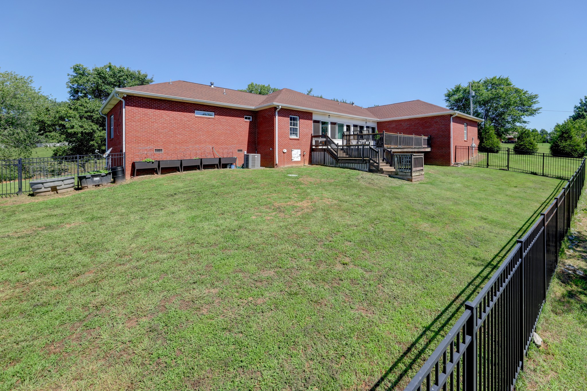 2251 Davidson Graveyard Road Clarksville, TN 37043 - Photo 67 of 78 a front view of a house with a garden and deck