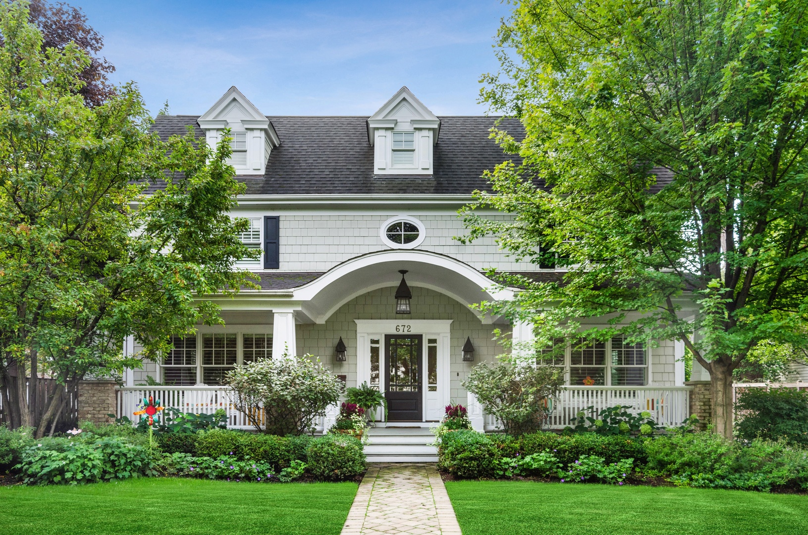 a front view of a house with garden