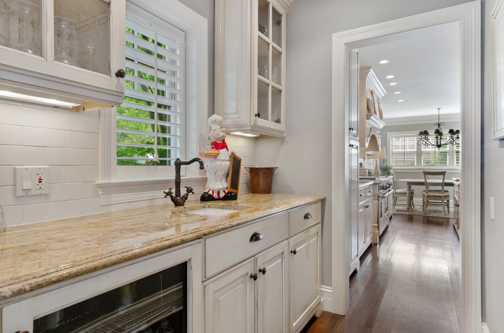 672 Elder Lane Winnetka, IL 60093 - Photo 11 of 32 a kitchen with a sink stove and cabinets