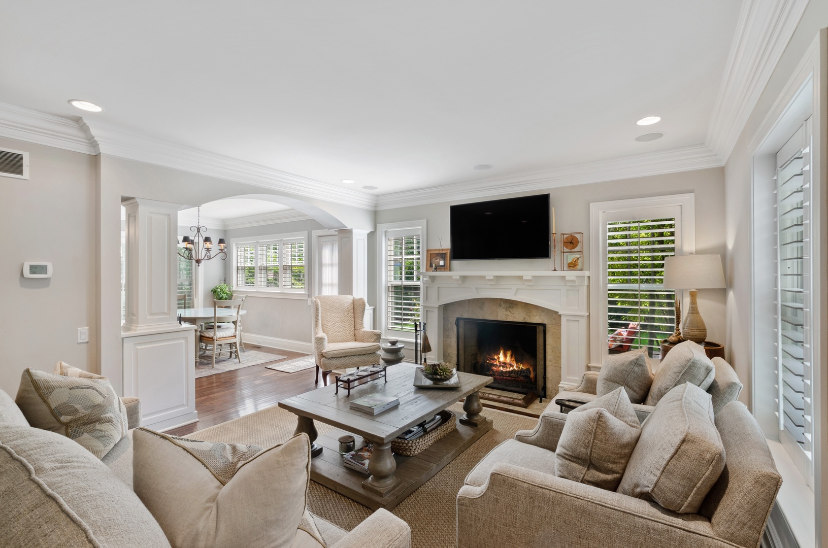 672 Elder Lane Winnetka, IL 60093 - Photo 13 of 32 a living room with furniture and a fireplace